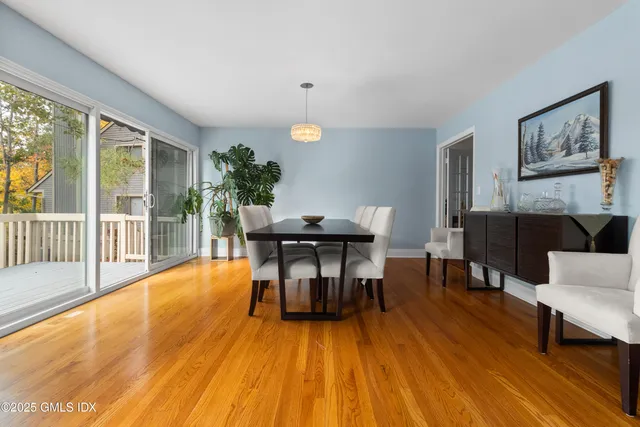 a view of a dining room with furniture window and wooden floor