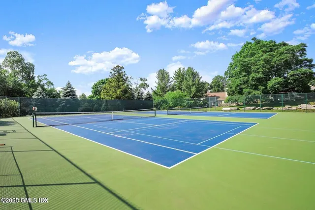 a view of an outdoor space and tennis court