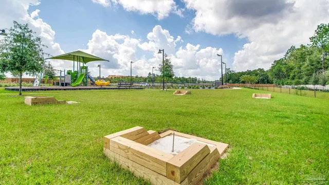 a swimming pool with barbeque in front of it