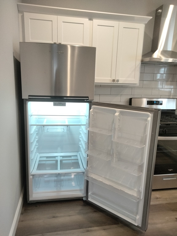 269 Brightman Street, Unit 2 Fall River, MA 02720 - Photo 9 of 12 a view of kitchen with a sink and a refrigerator