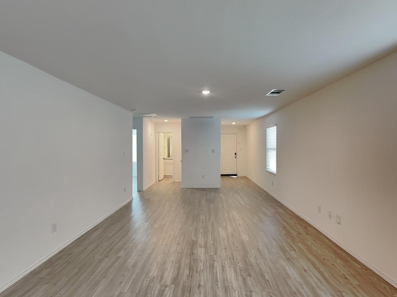 4133 Waterfall Cove San Antonio, TX 78223 - Photo 3 of 12 a view of an empty room and wooden floor
