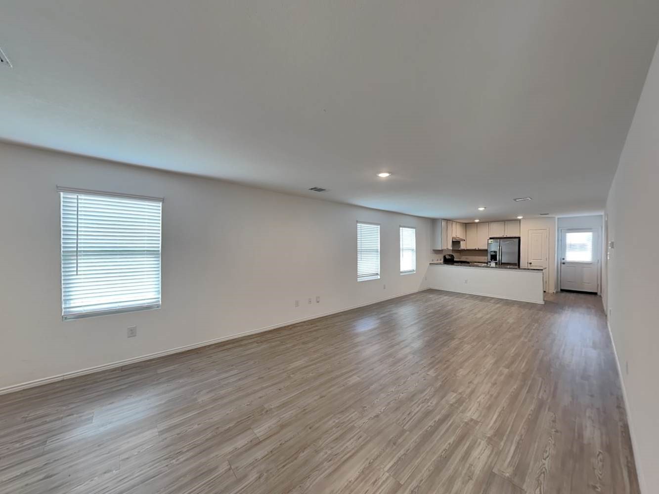 4133 Waterfall Cove San Antonio, TX 78223 - Photo 4 of 12 a view of a livingroom with wooden floor and a window