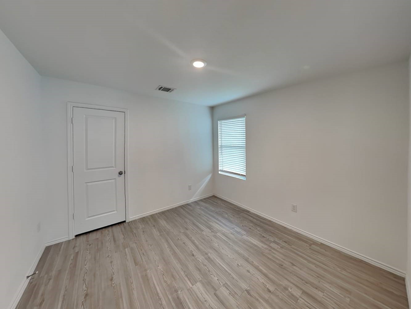 4133 Waterfall Cove San Antonio, TX 78223 - Photo 10 of 12 a view of an empty room with wooden floor and a window