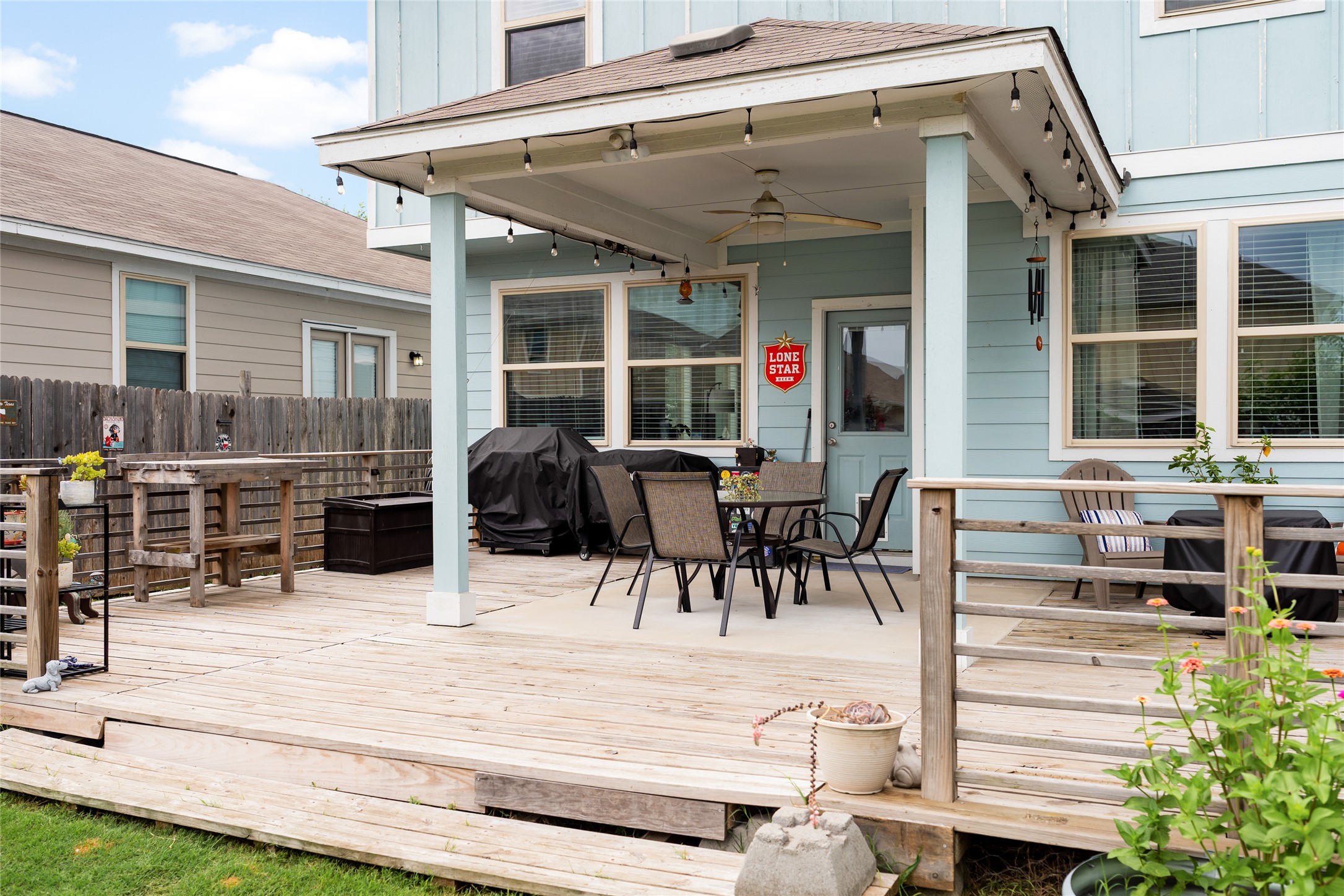 249 Wapiti Road Buda, TX 78610 - Photo 21 of 21 An inviting outdoor living space features a spacious wooden deck with a covered patio area.