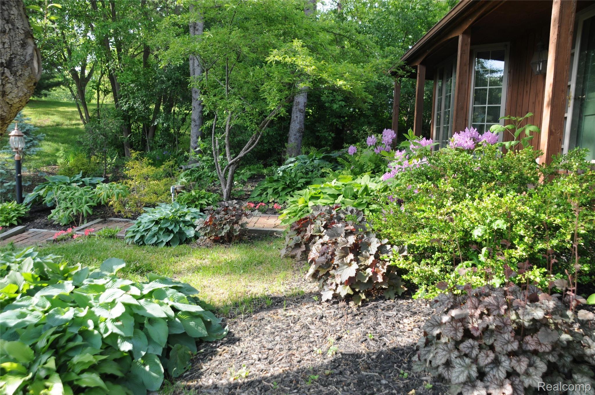 7838 Perry Lake Road Clarkston, MI 48348 - Photo 44 of 49 Yard Flowers2.JPG