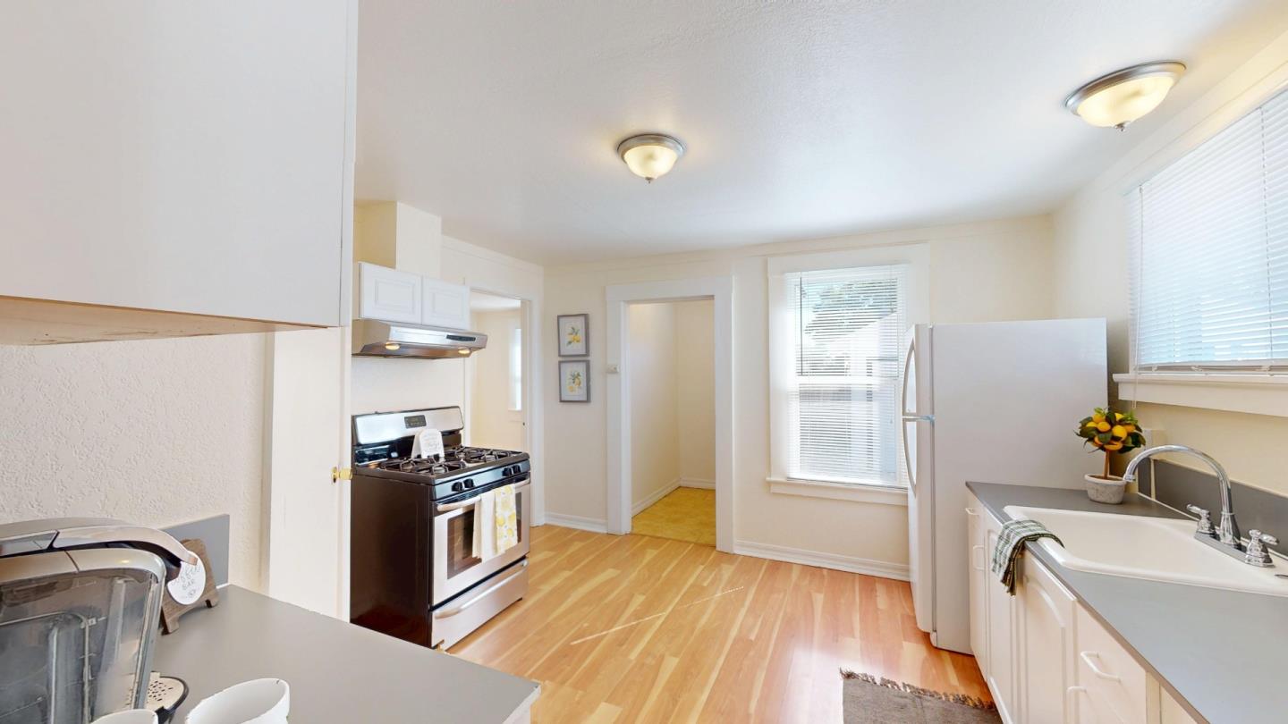236 West Street Soledad, CA 93960 - Photo 14 of 41 a kitchen with stainless steel appliances granite countertop a sink stove and refrigerator