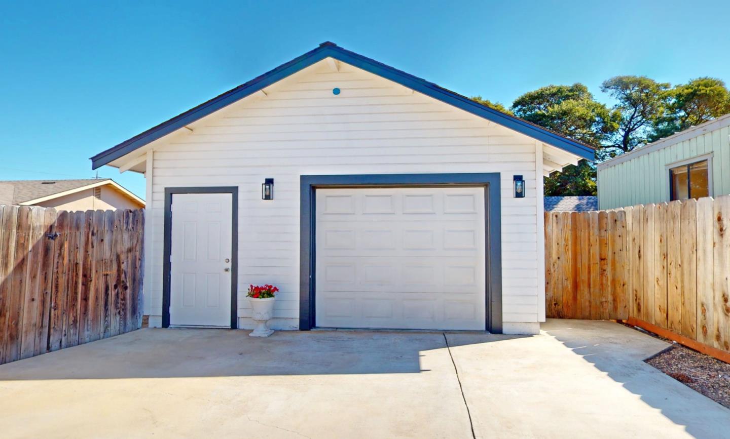 236 West Street Soledad, CA 93960 - Photo 31 of 41 a view of backyard of small house along with trees