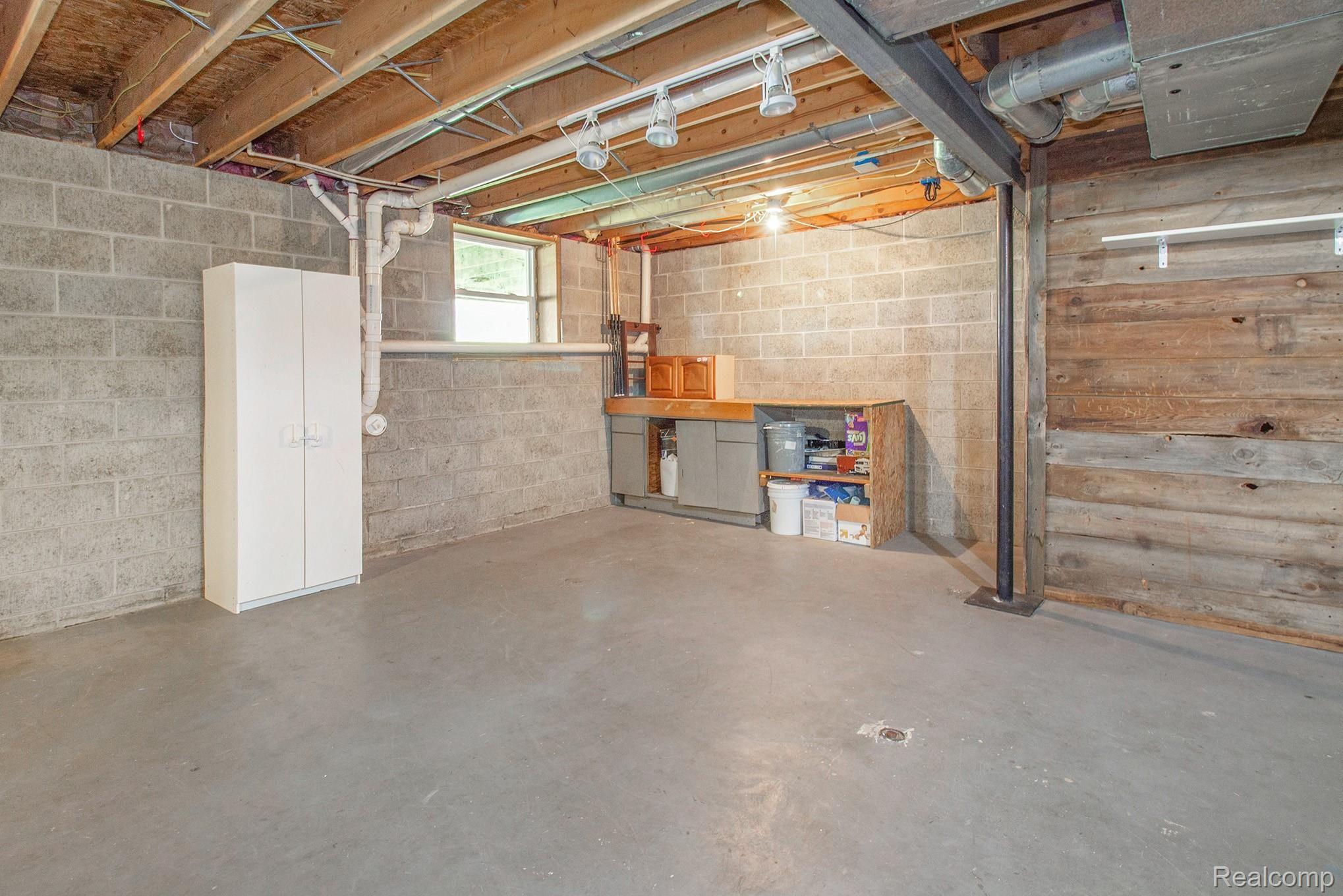 3235 South Bull Run Road Howell, MI 48843 - Photo 20 of 23 Dry block basement ready for your finishing touches
