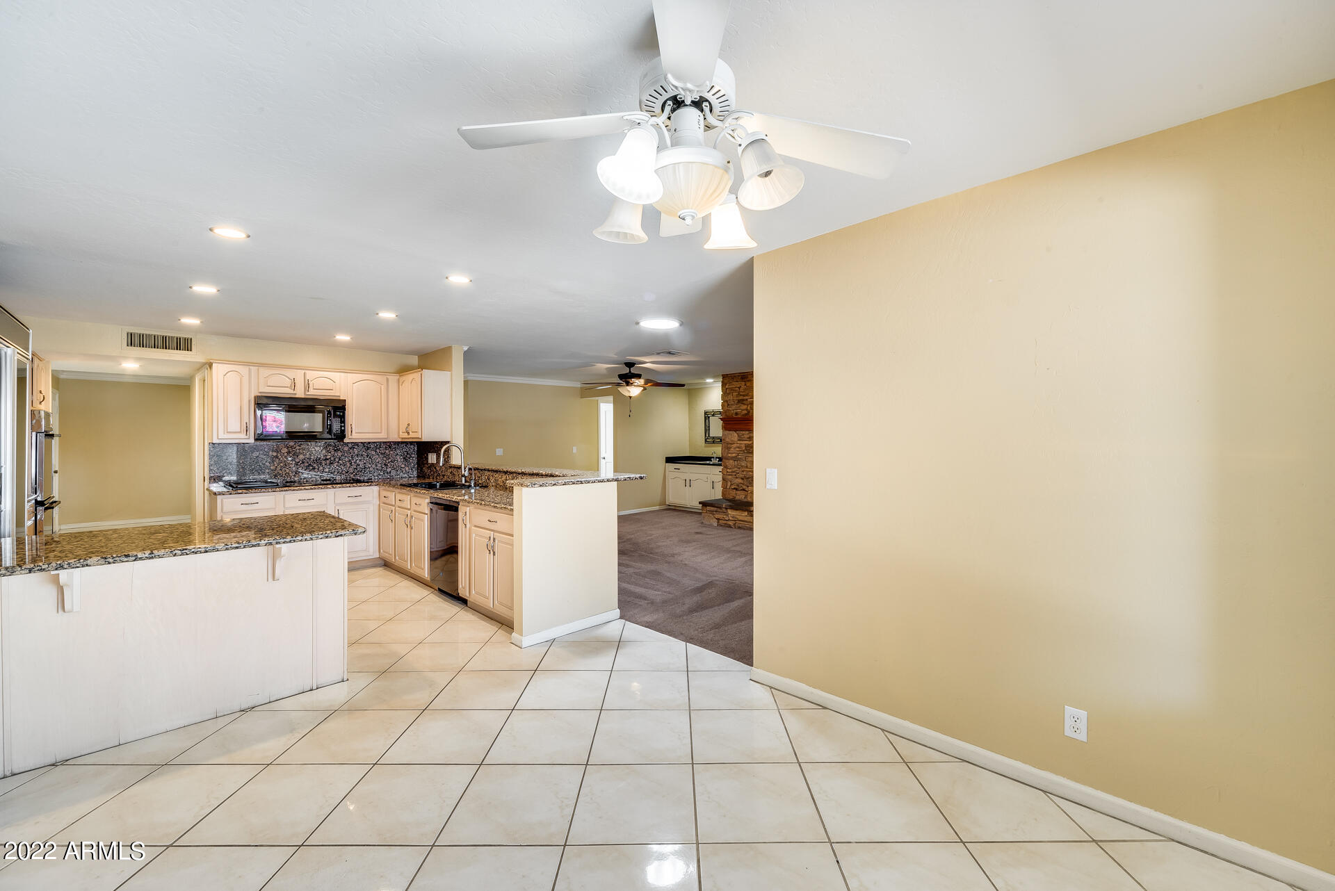 5501 East Camelback Road Phoenix, AZ 85018 - Photo 14 of 53 a large white kitchen with a sink and dishwasher a refrigerator with white cabinets