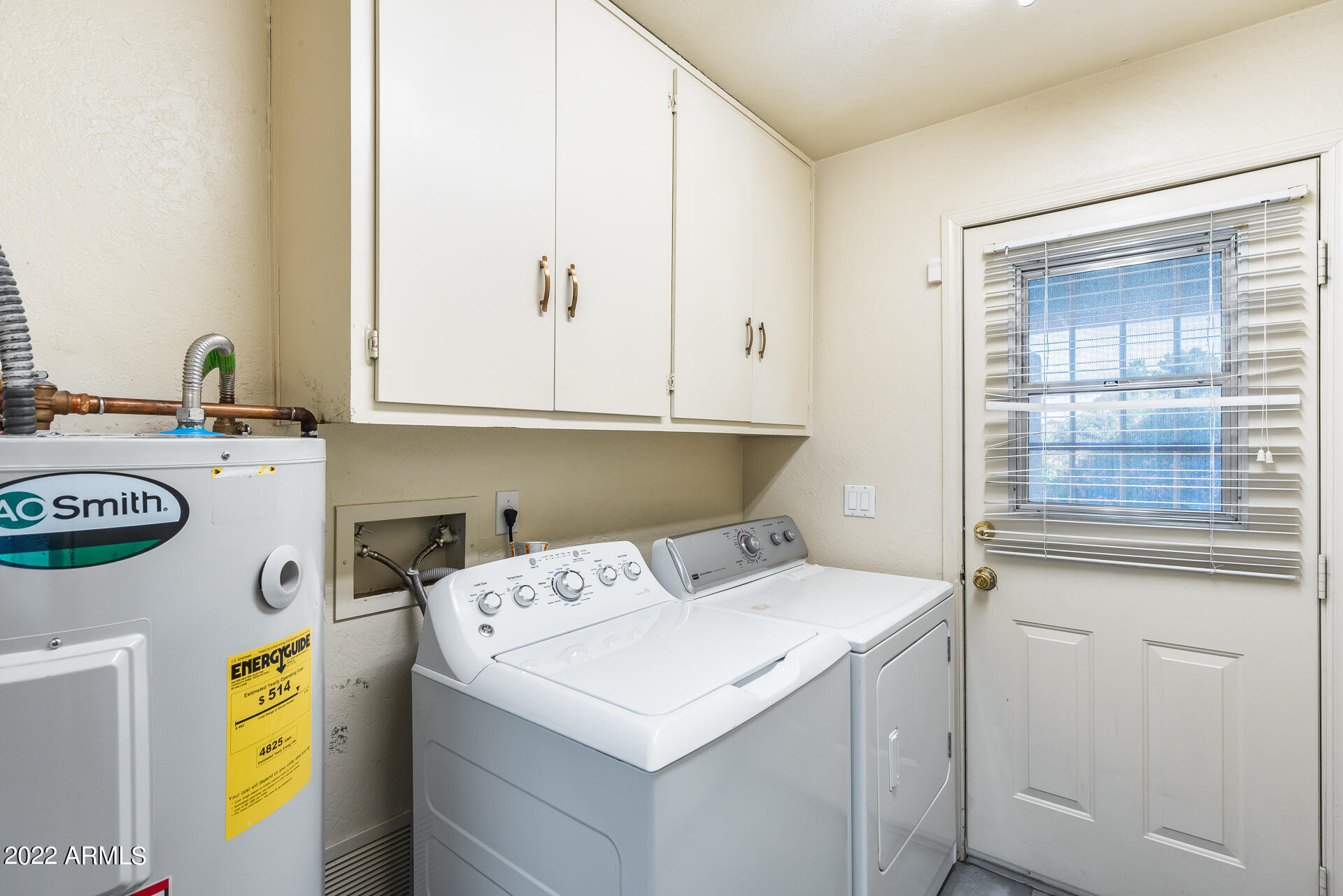 5501 East Camelback Road Phoenix, AZ 85018 - Photo 30 of 53 a utility room with dryer and washer
