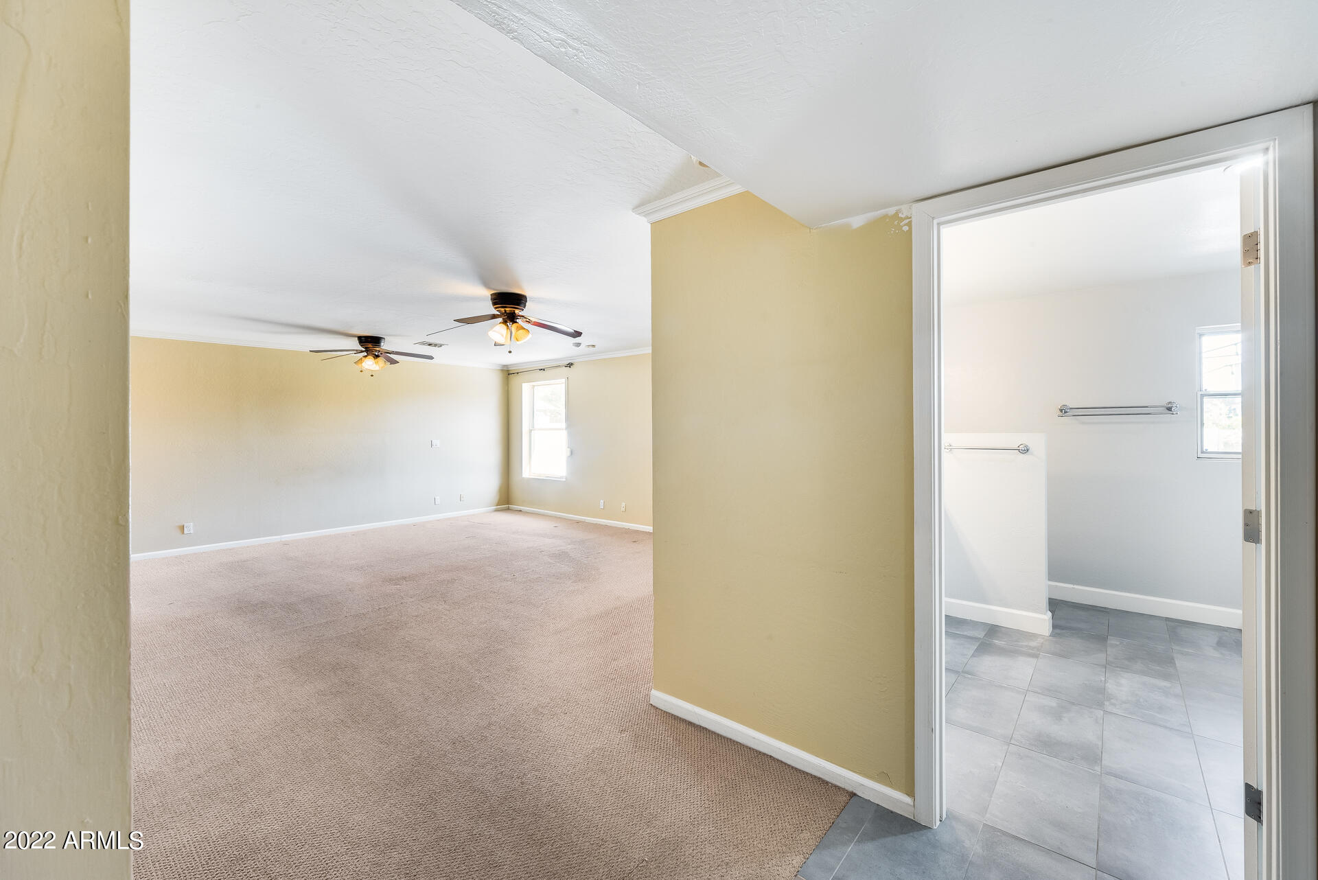 5501 East Camelback Road Phoenix, AZ 85018 - Photo 35 of 53 a view of a big room with closet and chandelier fan