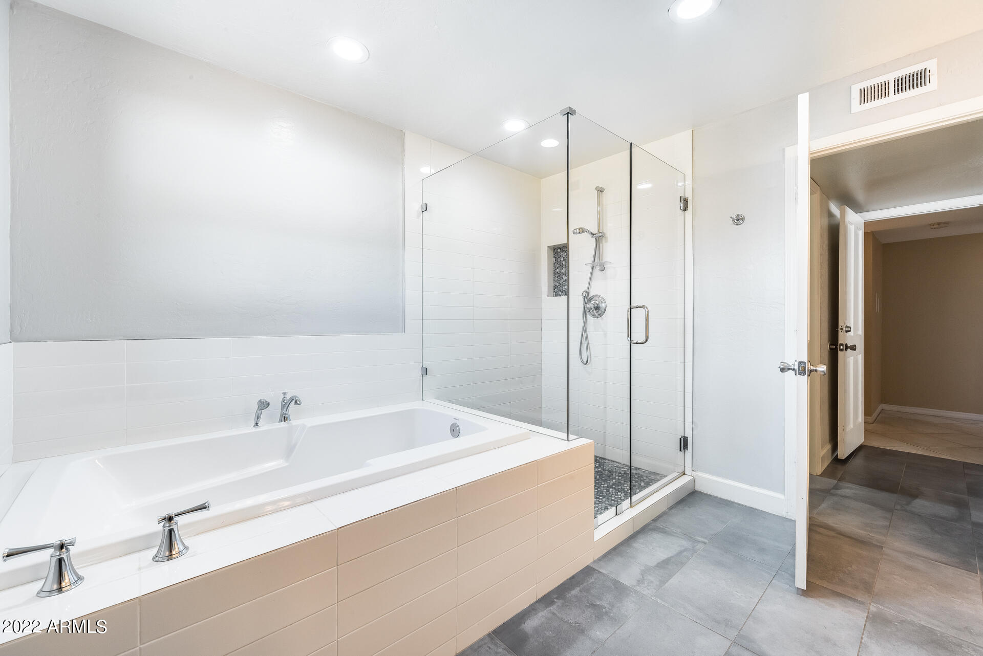 5501 East Camelback Road Phoenix, AZ 85018 - Photo 38 of 53 a spacious bathroom with a tub shower and sink