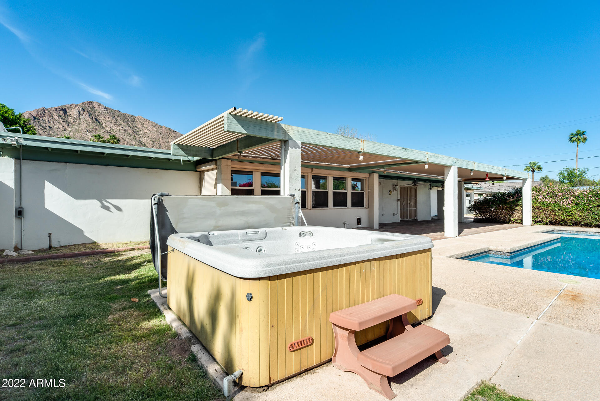 5501 East Camelback Road Phoenix, AZ 85018 - Photo 52 of 53 a view of a house with pool and chairs