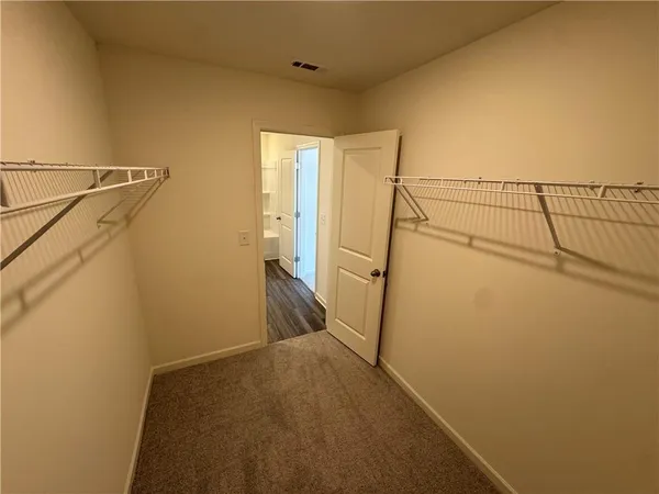 a view of storage and utility room with a sink