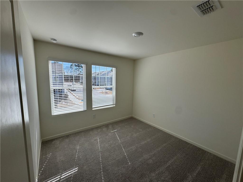 506 Robson Drive Villa Rica, GA 30180 - Photo 12 of 19 a view of an empty room with a window