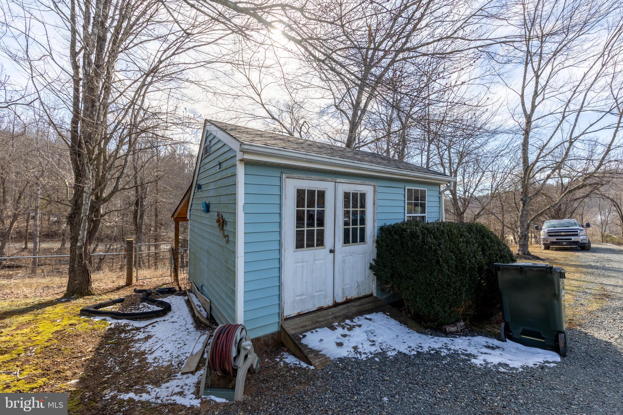 165 Brokenback Mountain Road Free Union, VA 22940 - Photo 19 of 71 a view of backyard with a barn and a large tree