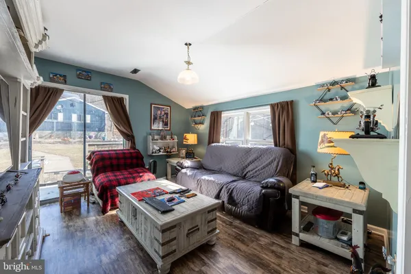 a bedroom with furniture and a flat screen tv