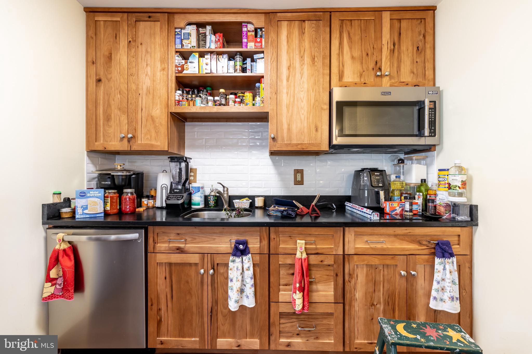 165 Brokenback Mountain Road Free Union, VA 22940 - Photo 53 of 71 a kitchen with stainless steel appliances granite countertop a stove and cabinets