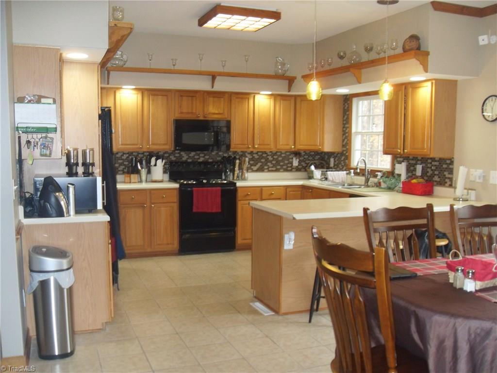 338 Fox Run View Lane Trinity, NC 27370 - Photo 2 of 21 Kitchen overlooking wooded back yard and easy access to deck for entertaining