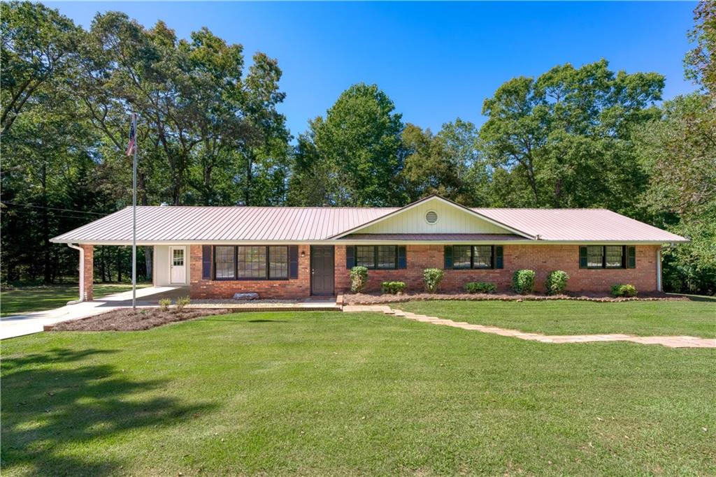 a big house with a big yard and large trees