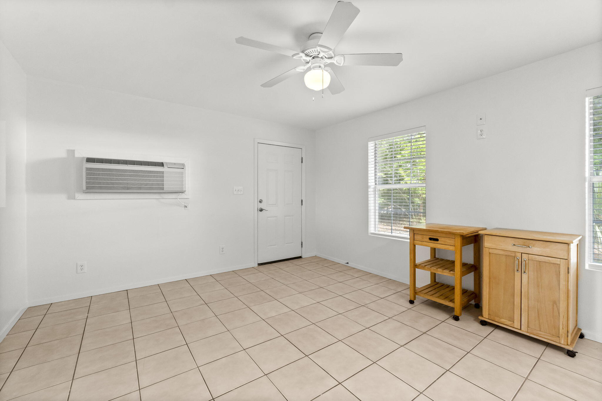 133 Sunrise Circle, Unit B Santa Rosa Beach, FL 32459 - Photo 11 of 25 an empty room with windows and fan