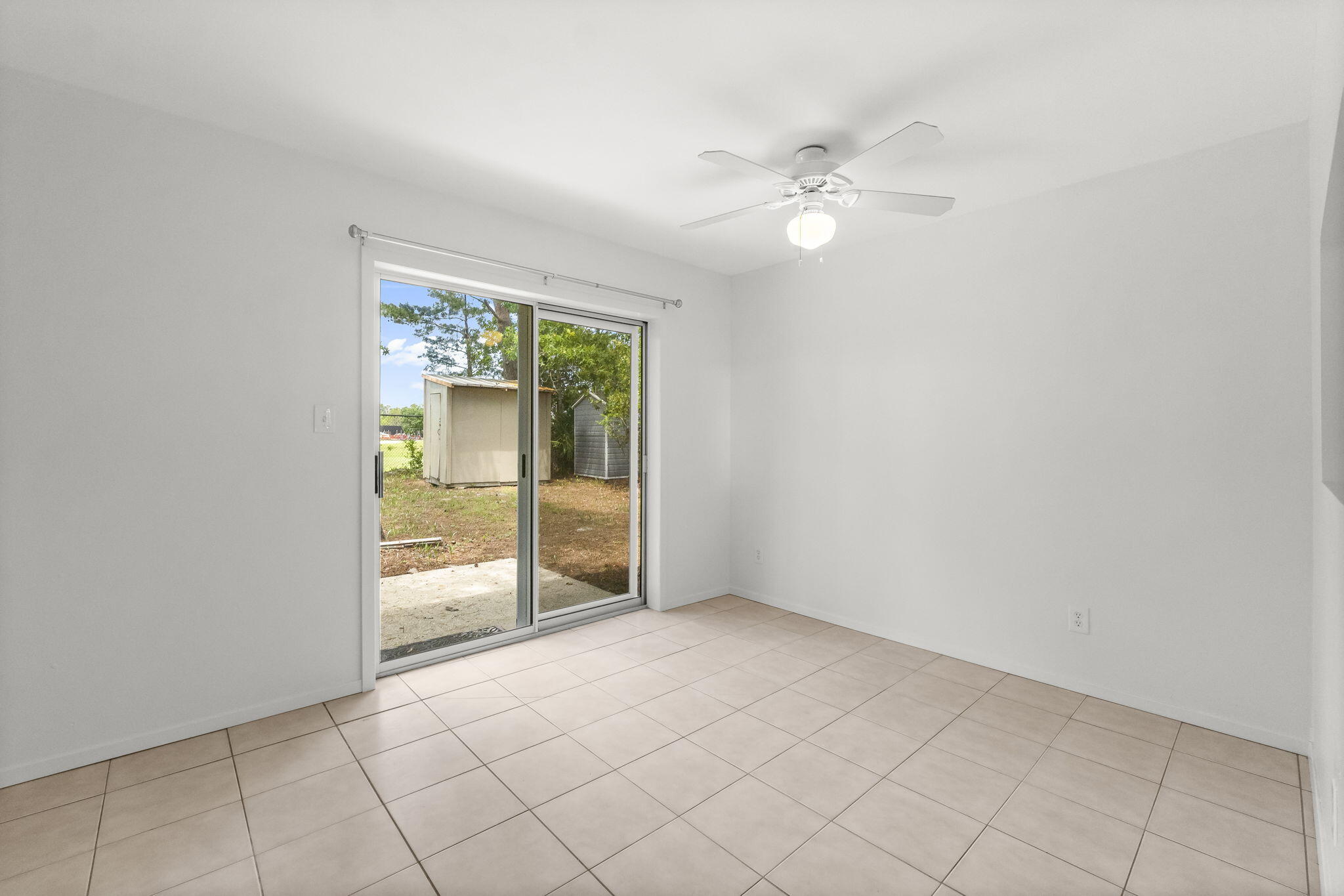 133 Sunrise Circle, Unit B Santa Rosa Beach, FL 32459 - Photo 17 of 25 a view of an empty room with a fan