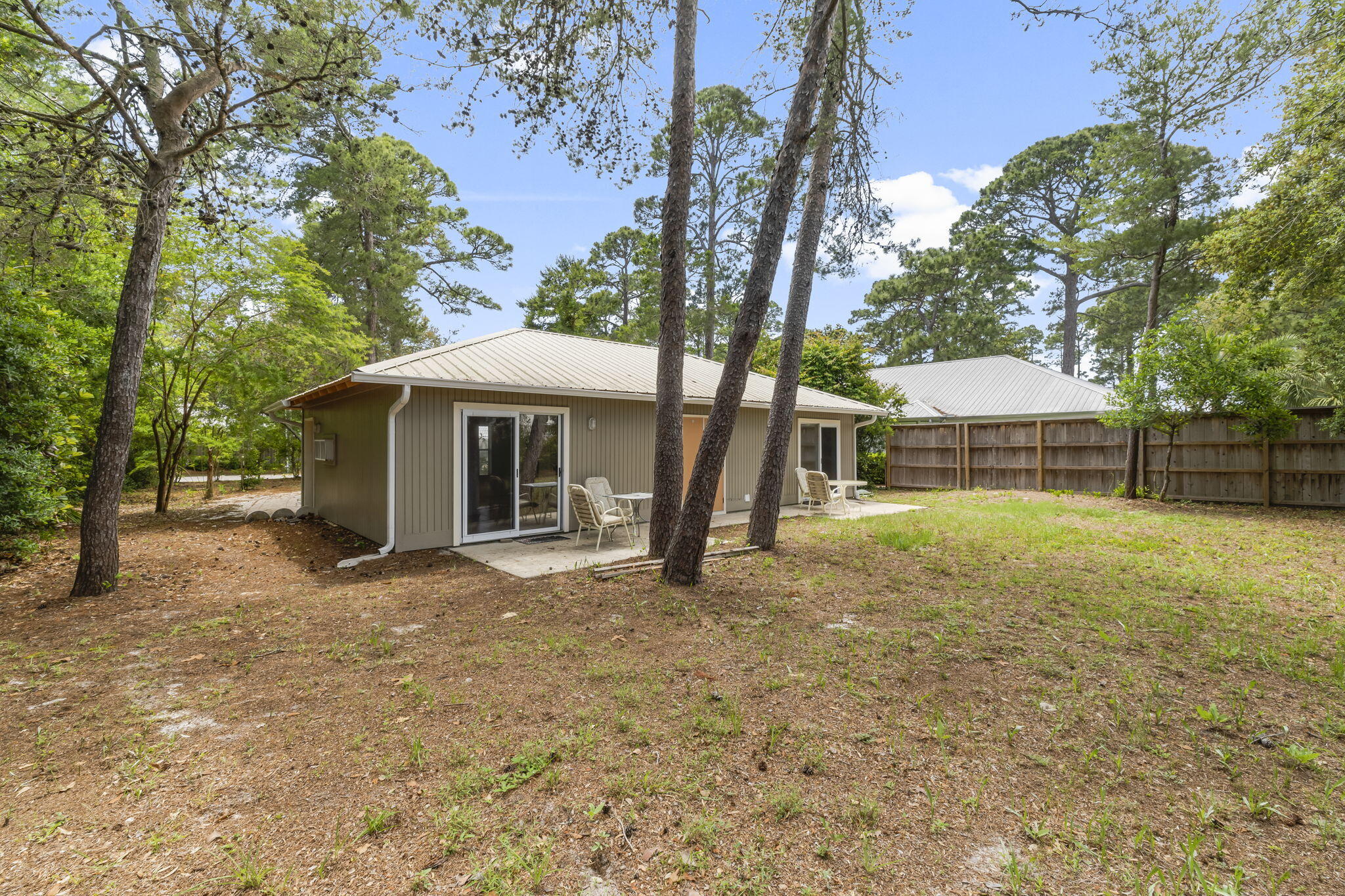 133 Sunrise Circle, Unit B Santa Rosa Beach, FL 32459 - Photo 18 of 25 a view of a house with a yard