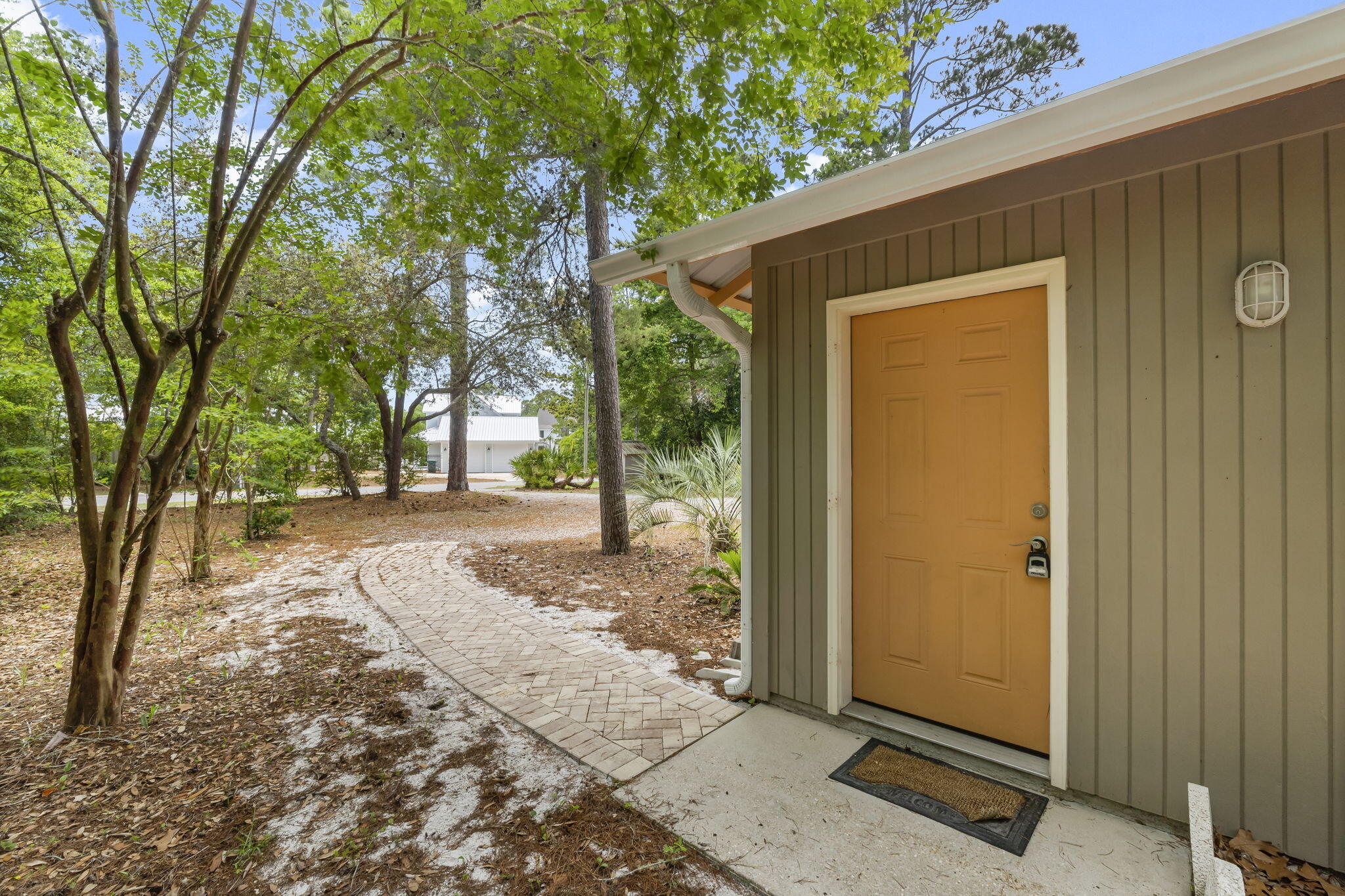133 Sunrise Circle, Unit B Santa Rosa Beach, FL 32459 - Photo 2 of 25 a view of a yard with a tree