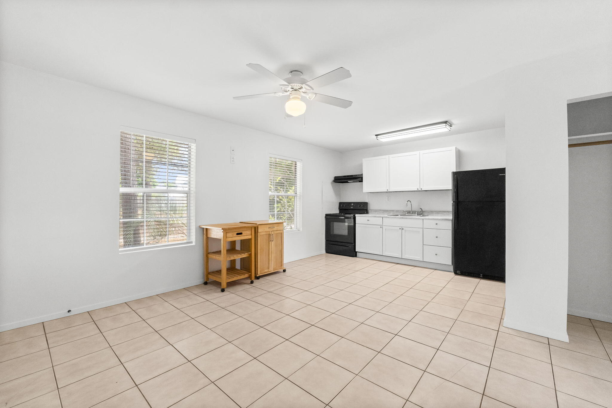 133 Sunrise Circle, Unit B Santa Rosa Beach, FL 32459 - Photo 5 of 25 a kitchen with white cabinets and appliances