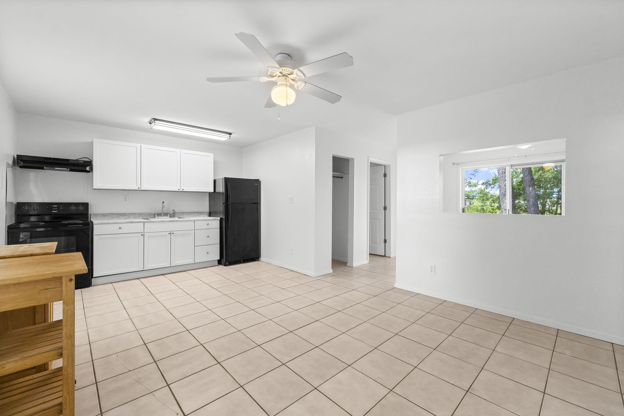 133 Sunrise Circle, Unit B Santa Rosa Beach, FL 32459 - Photo 6 of 25 a large white kitchen with cabinets
