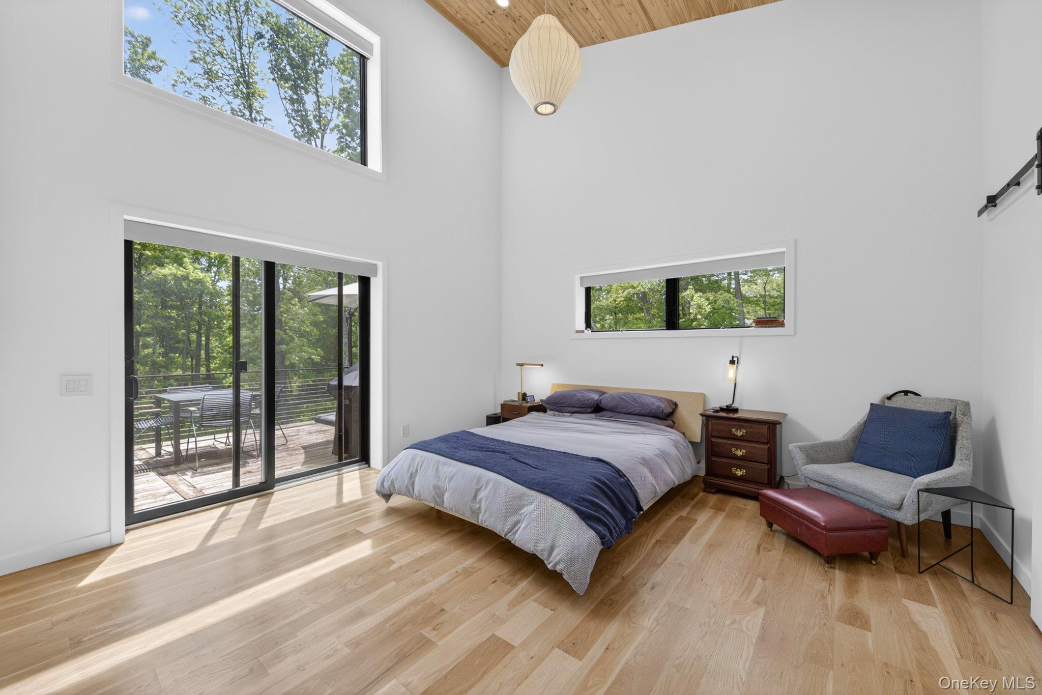 739 Old Post Road New Paltz, NY 12561 - Photo 22 of 47 The primary bedroom featuring a vaulted wood-paneled ceiling