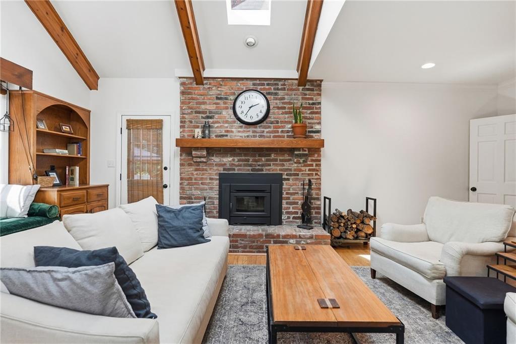 900 Settlers Ridge Road Pittsburgh, PA 15238 - Photo 10 of 50 The wood-burning brick fireplace creates a warm focal point, making the family room an ideal gathering space throughout the seasons.