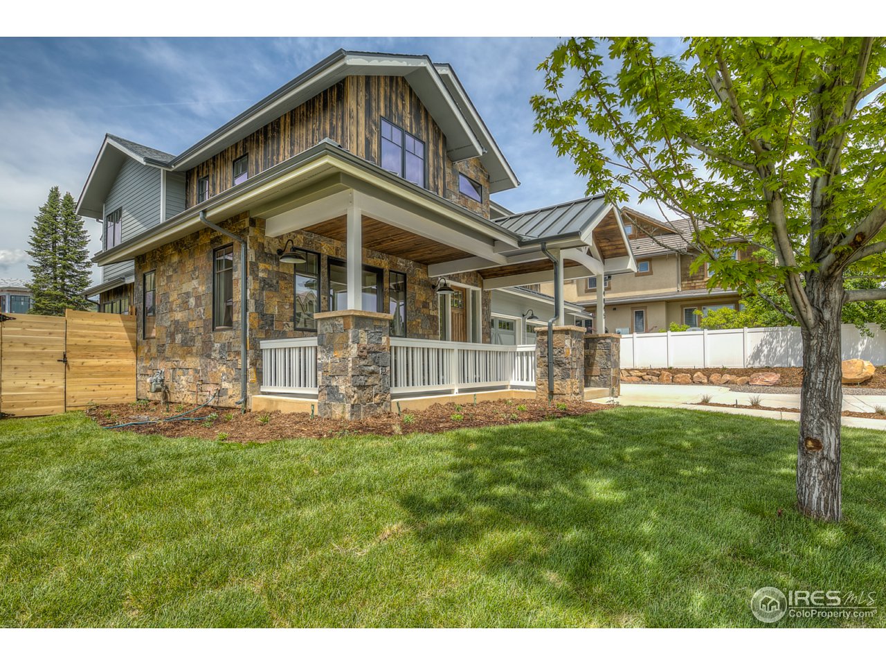 4845 6th Street Boulder, CO 80304 - Photo 3 of 25 a front view of a house with a yard