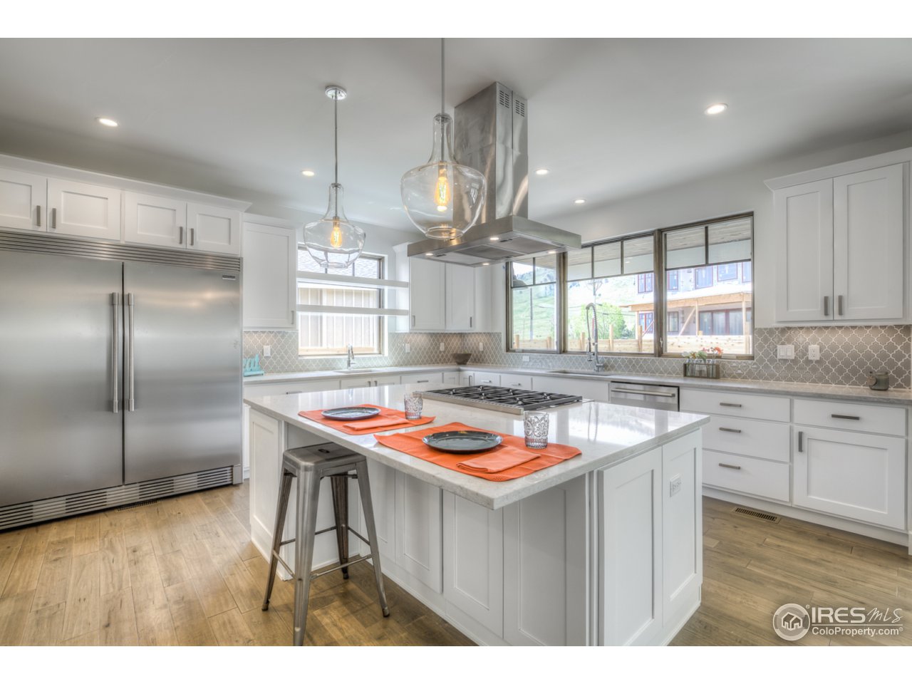 4845 6th Street Boulder, CO 80304 - Photo 6 of 25 a kitchen with stainless steel appliances granite countertop a sink a stove and a refrigerator