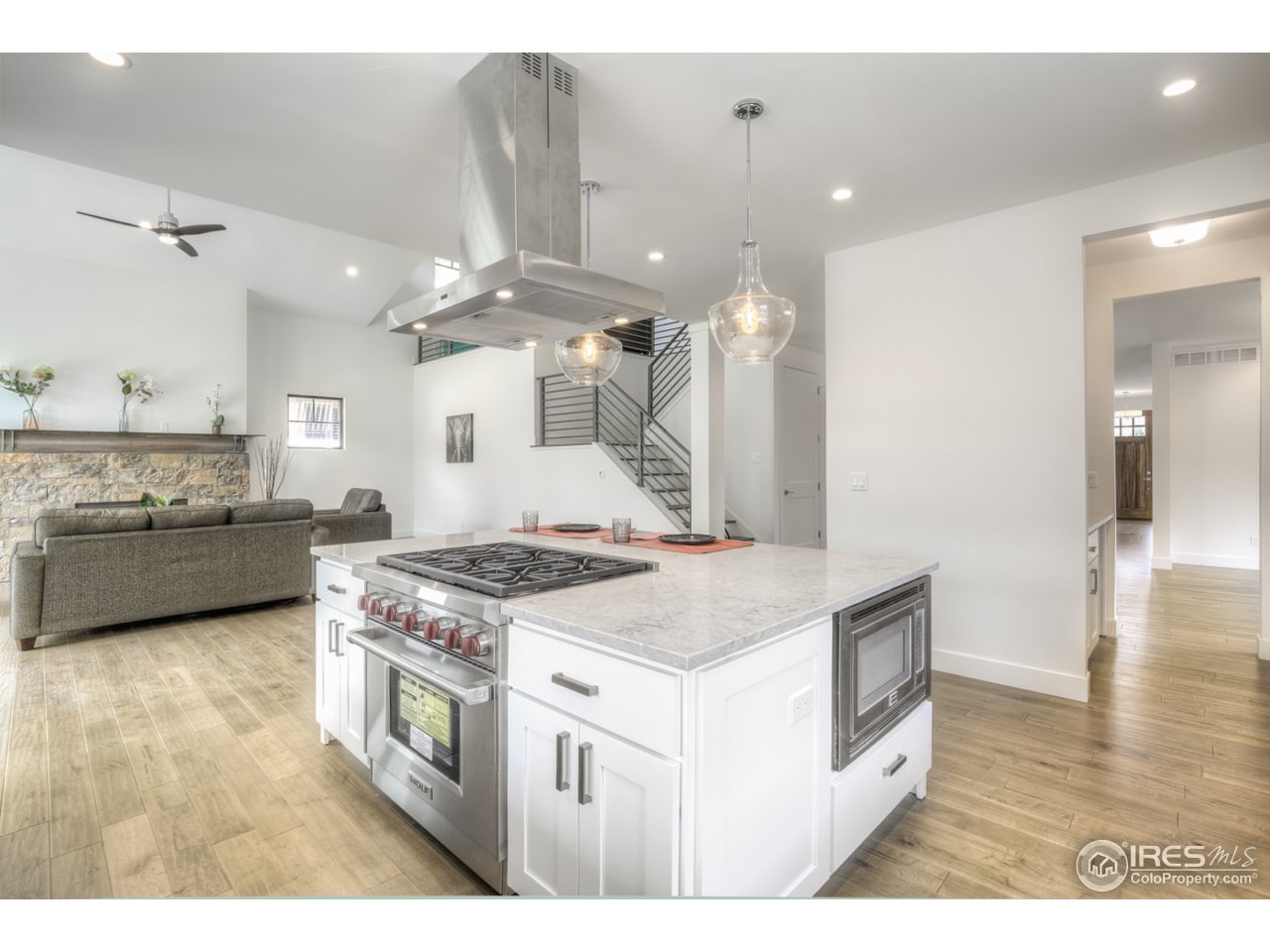 4845 6th Street Boulder, CO 80304 - Photo 9 of 25 a kitchen with a stove a sink and a refrigerator