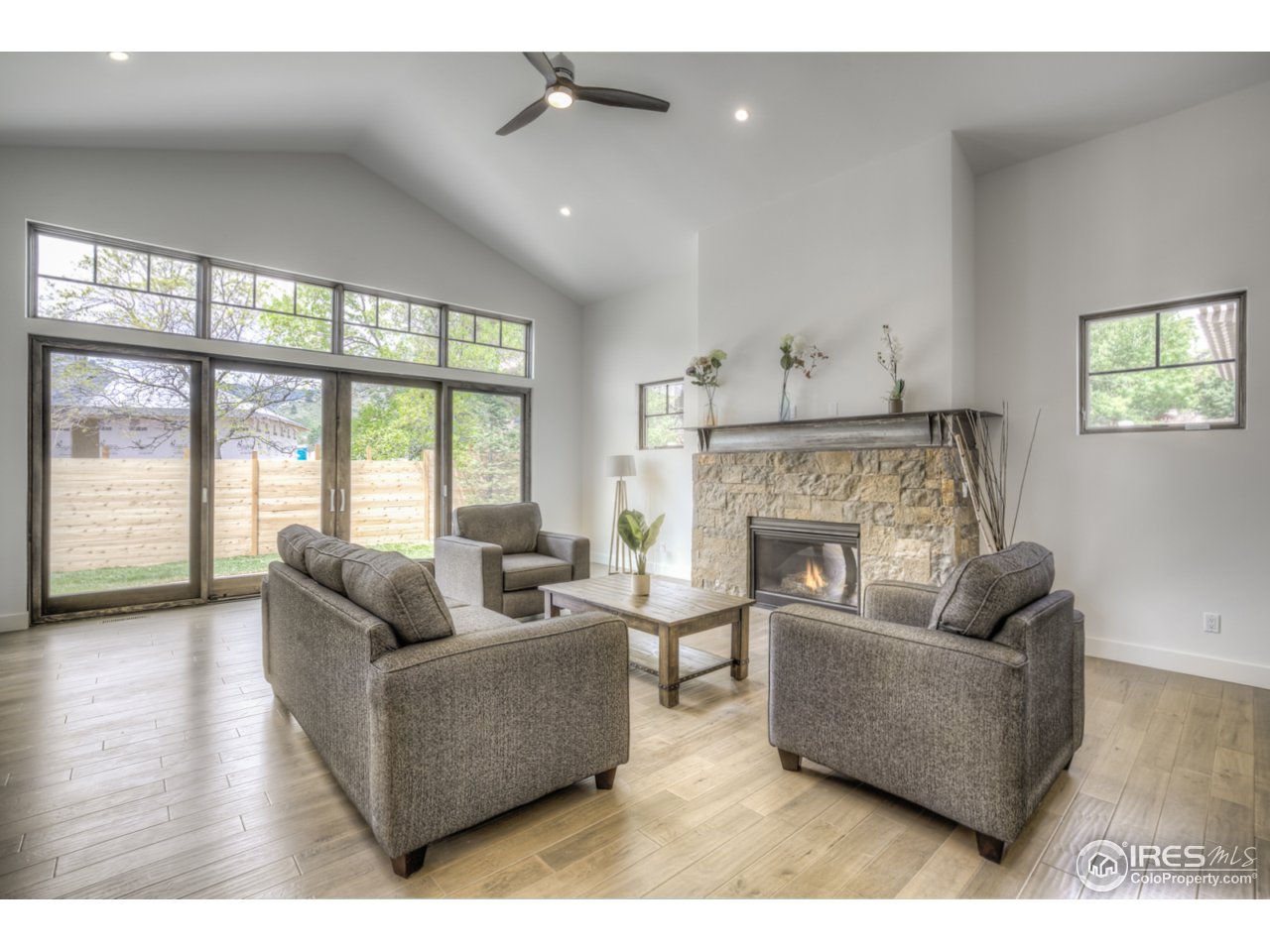 4845 6th Street Boulder, CO 80304 - Photo 10 of 25 a living room with furniture and a fireplace
