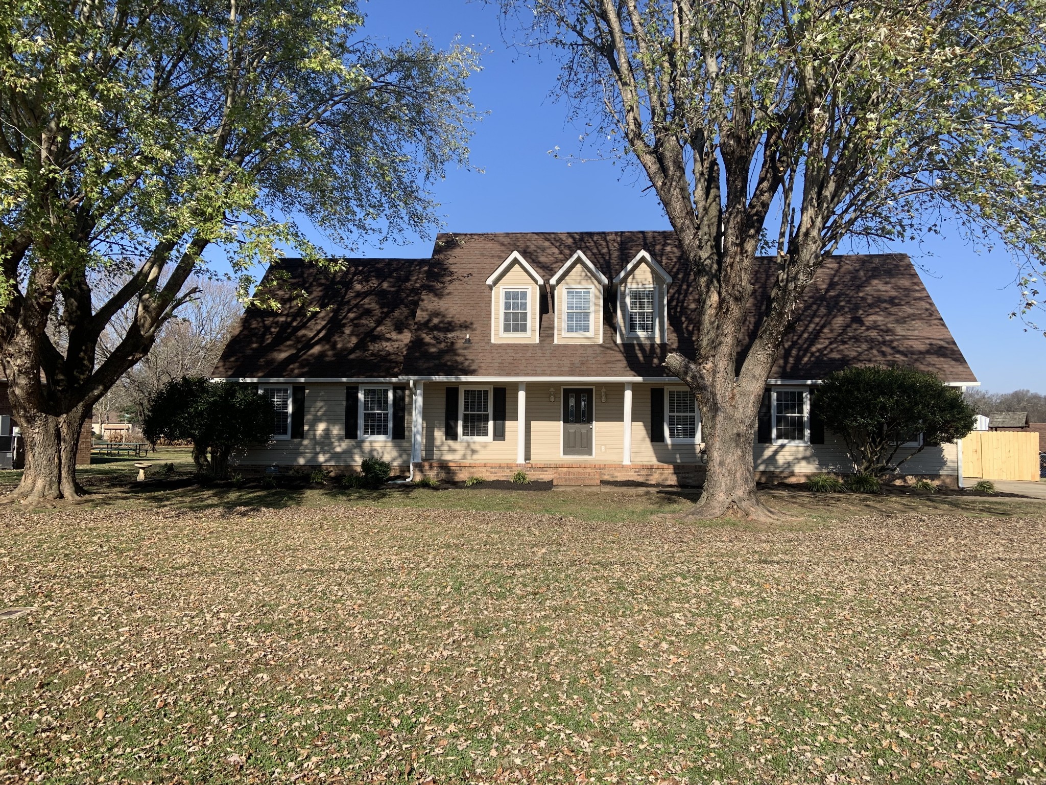 a front view of a house with a yard