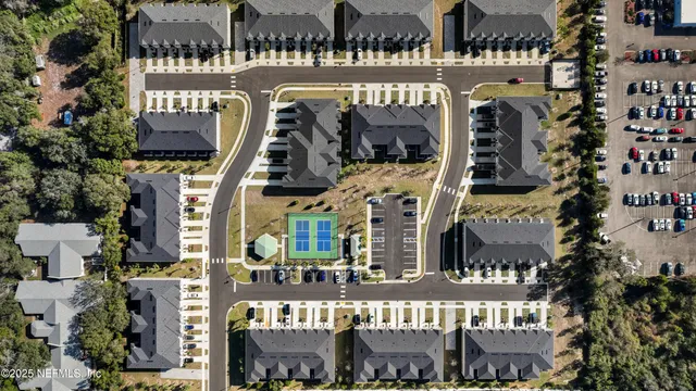 a front view of a building with retail shops