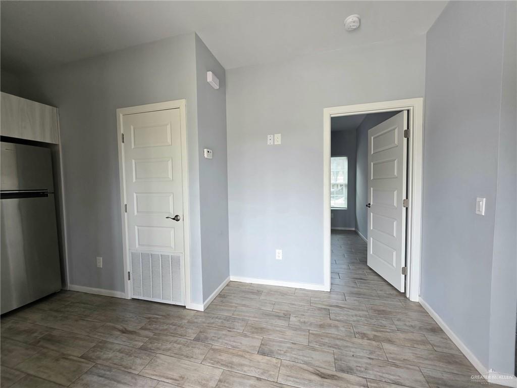 1514 Quitaca Drive, Unit 3 Edinburg, TX 78541 - Photo 8 of 10 wooden floor and closet in a room