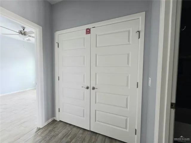 an empty room with wooden floor