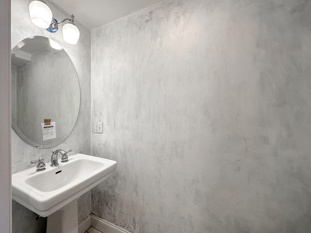 29 Douglas Road Needham, MA 02492 - Photo 12 of 42 a bathroom with a sink and a mirror