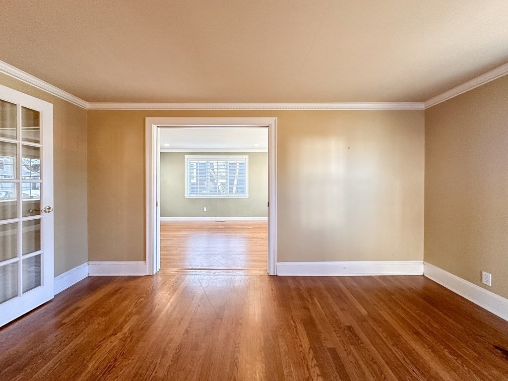 29 Douglas Road Needham, MA 02492 - Photo 14 of 42 an empty room with wooden floor cabinet and windows