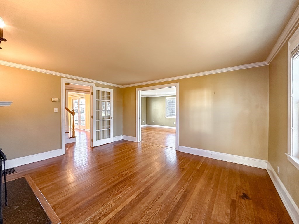 29 Douglas Road Needham, MA 02492 - Photo 15 of 42 an empty room with wooden floor and windows
