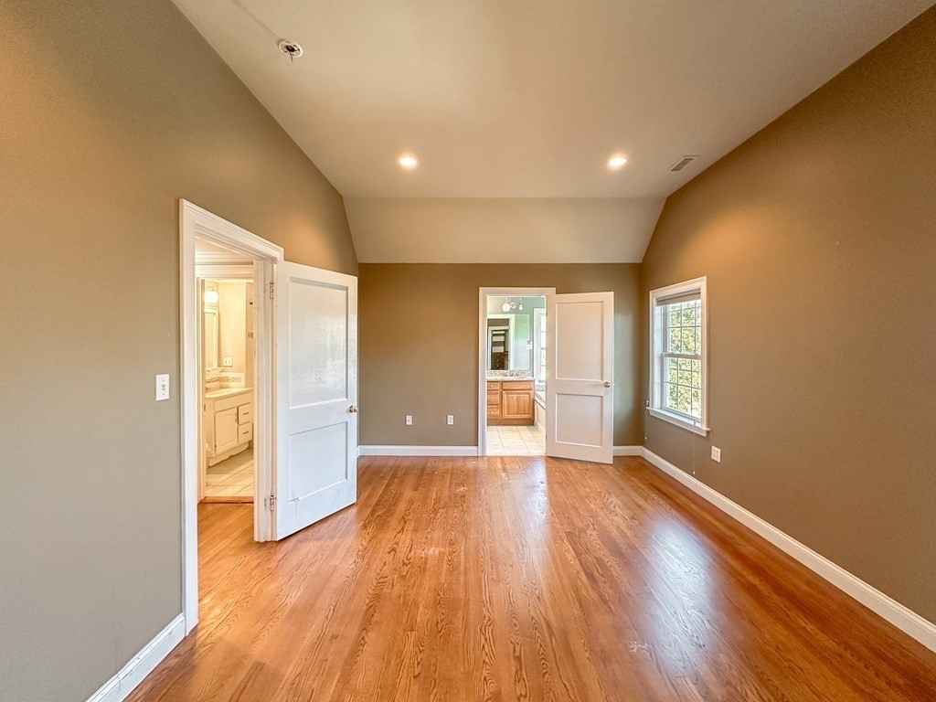 29 Douglas Road Needham, MA 02492 - Photo 20 of 42 a view of an empty room with window and wooden floor