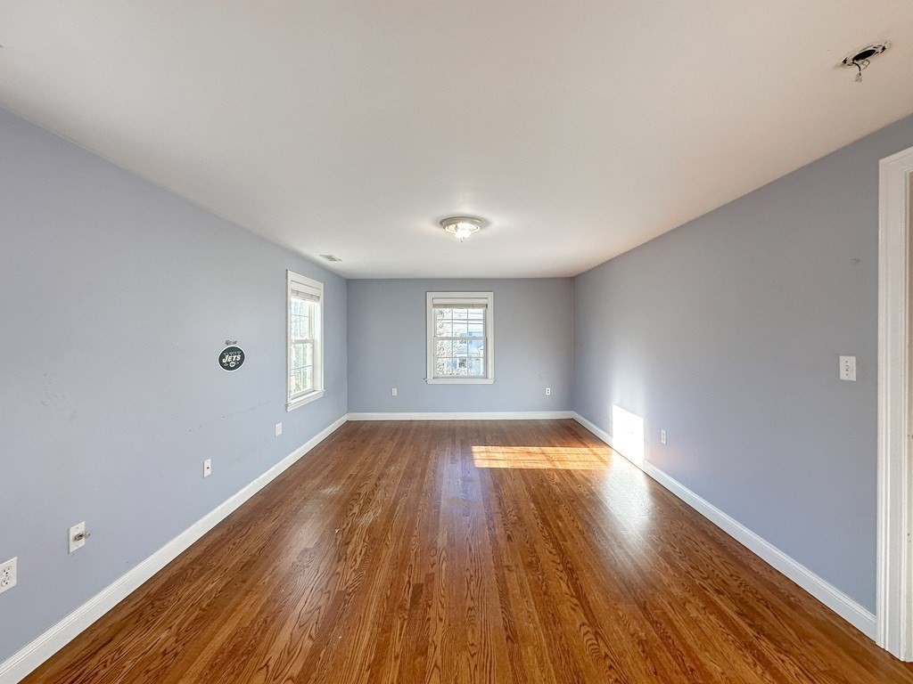 29 Douglas Road Needham, MA 02492 - Photo 24 of 42 a view of empty room with wooden floor and fan