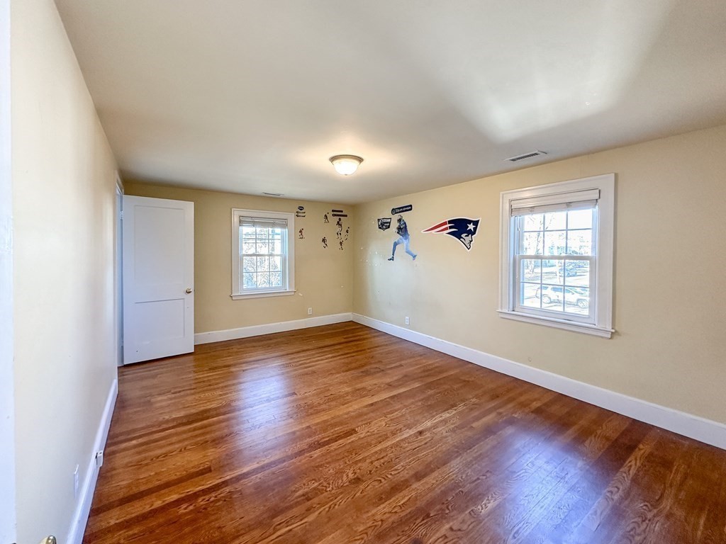 29 Douglas Road Needham, MA 02492 - Photo 28 of 42 an empty room with wooden floor and windows