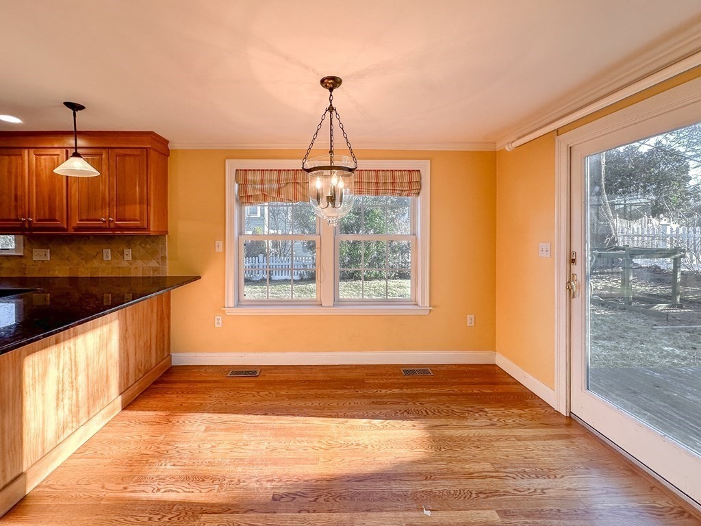 29 Douglas Road Needham, MA 02492 - Photo 5 of 42 a view of a kitchen with wooden floor and a window