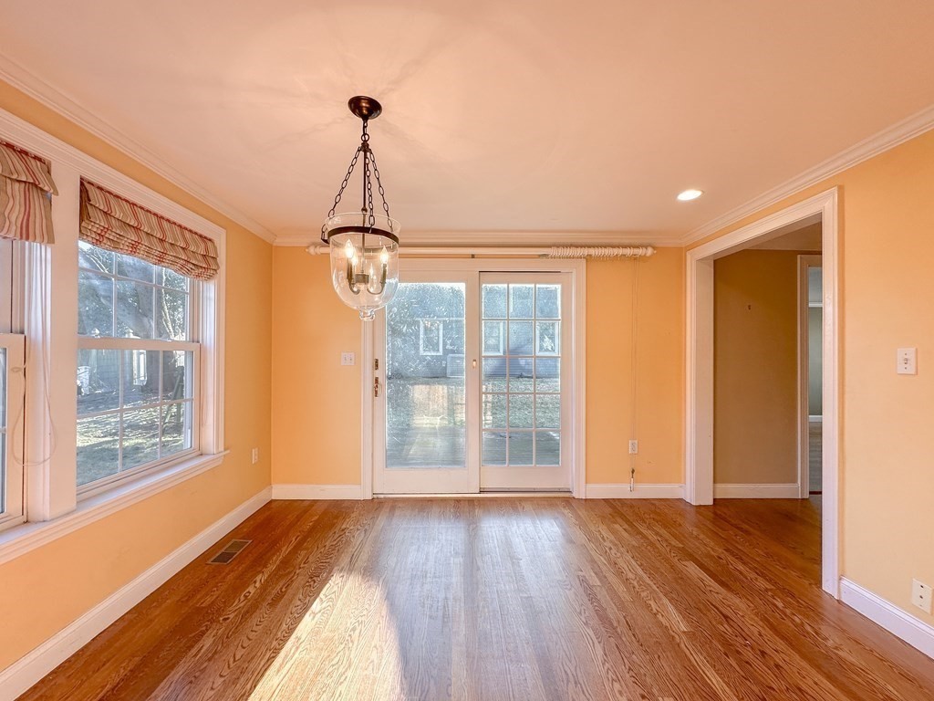 29 Douglas Road Needham, MA 02492 - Photo 7 of 42 a view of empty room with wooden floor and windows