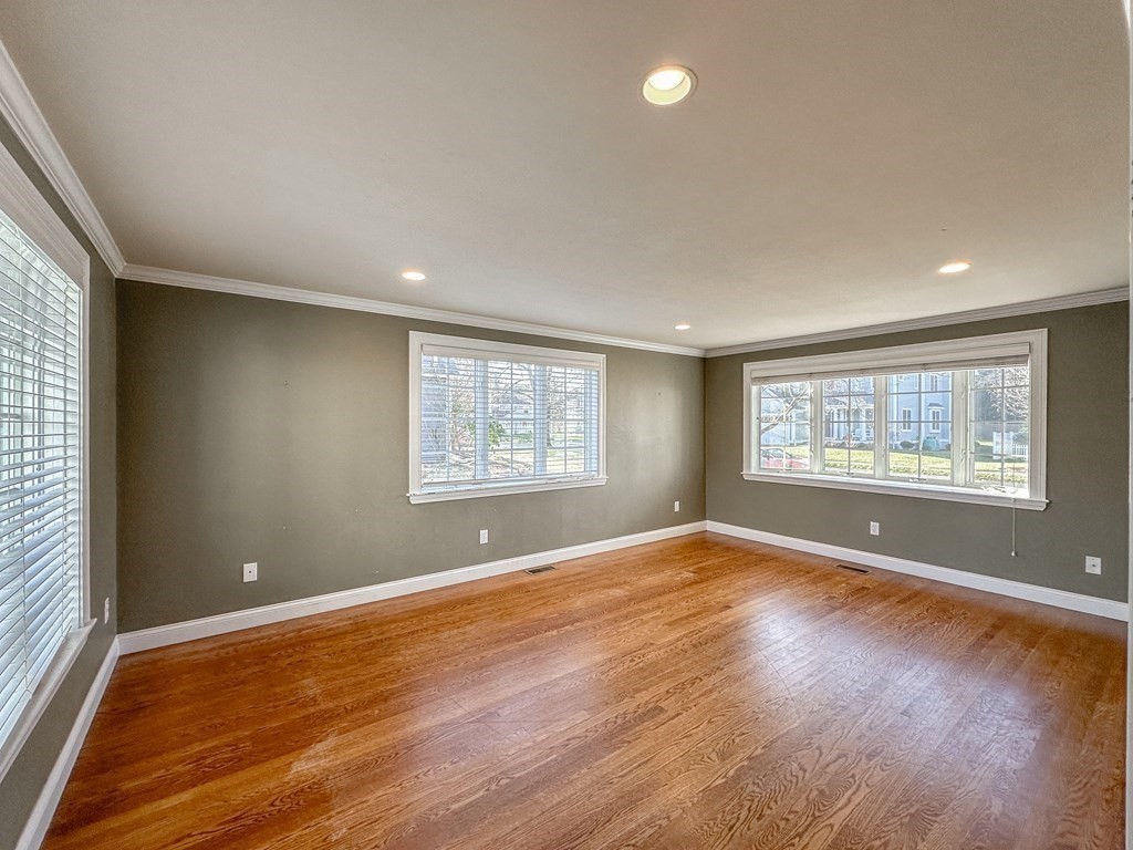 29 Douglas Road Needham, MA 02492 - Photo 8 of 42 a view of an empty room with wooden floor and a window