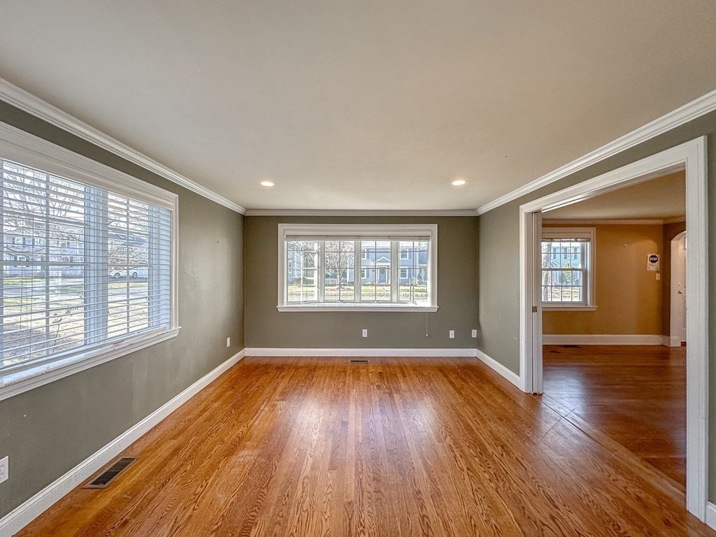 29 Douglas Road Needham, MA 02492 - Photo 9 of 42 a view of an empty room with wooden floor and a window